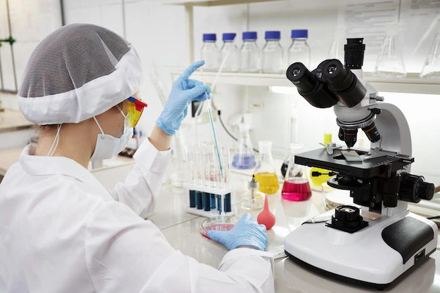 side-view-smiley-female-scientists-working-lab_