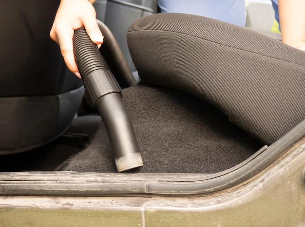 When cleaning, avoid excessive use of water or cleaning solutions to prevent over-saturation and potential damage to the car's carpet padding.