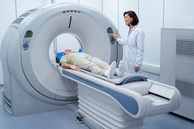 doctor-getting-patient-ready-ct-scan