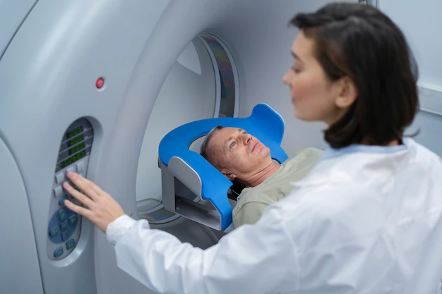 doctor-getting-patient-ready-ct-scan