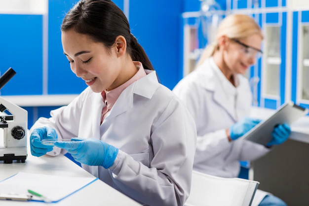 side-view-smiley-female-scientists-working-lab_